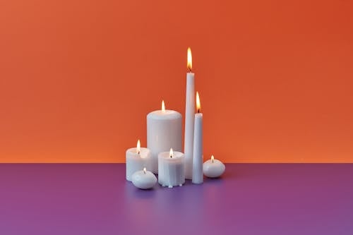 Burning Candles in Different Shapes 