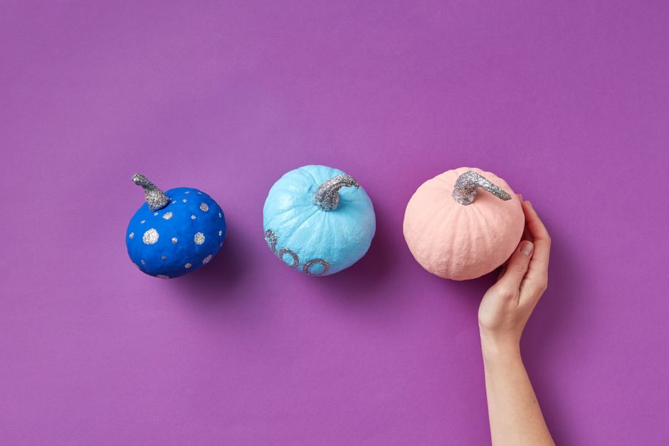Fabric Pumpkin Trio DIY home decor project — Three decorated pumpkins on a purple background, symbolizing creative Halloween decorations.