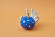 Blue Pumpkin Decoration on Ceramic Hand