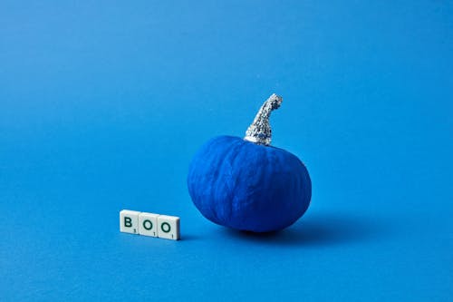 Blue Pumpkin and Letters on Studio Background
