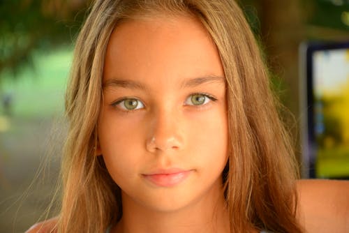A Close-Up Shot of a Girl with Green Eyes