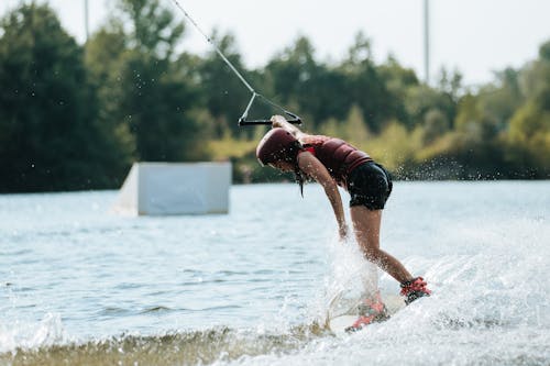 A Woman Wake Boarding on the Lake