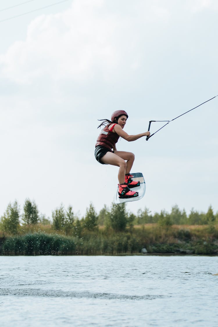 A Woman Riding A Wake Board