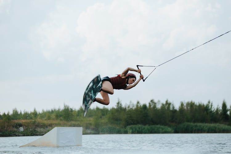 A Woman Wake Boarding On The Lake