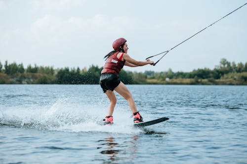 Woman Holding on Handle with Rope Wakeboarding