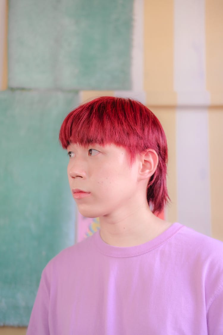 Man With Red Dyed Hair And Pink Shirt