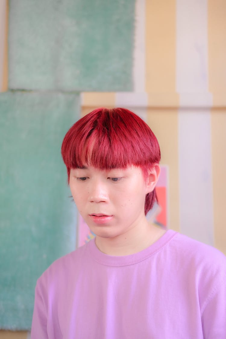 Man With Red Dyed Hair And Pink Shirt