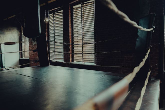 Empty ring in a low-lit gym — photo by Stanislav Kondratiev on Pexels