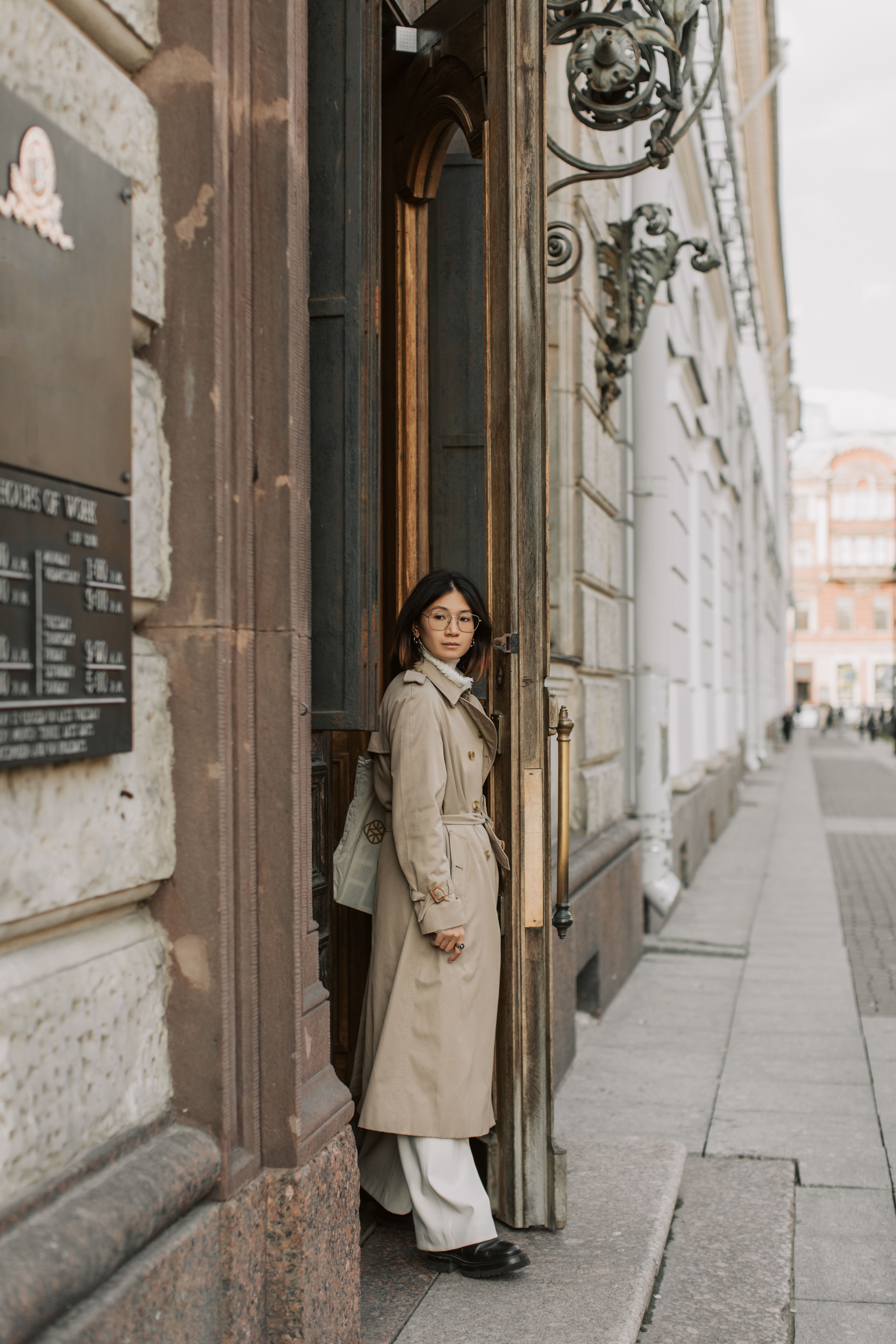 A Woman Wearing a Long Trench Coat · Free Stock Photo