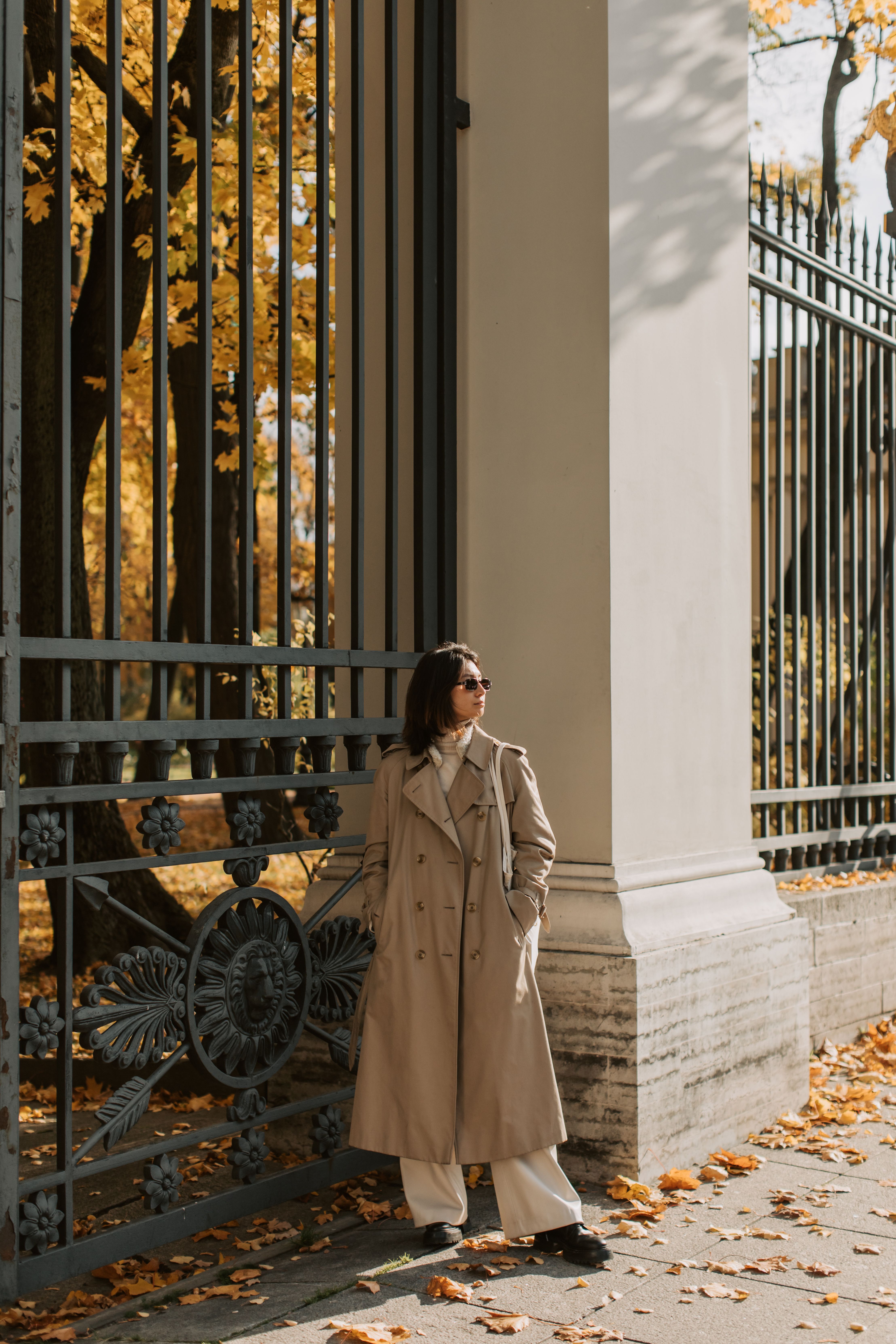 A Woman Wearing a Long Trench Coat · Free Stock Photo