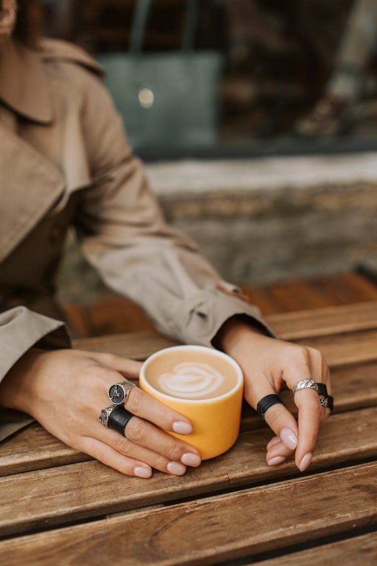 Person Holding A Cup Of Coffee