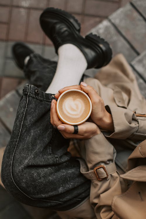 Free Person Holding a Cup of Cappuccino Stock Photo