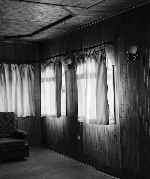 Grayscale Photography of Windows with Curtains