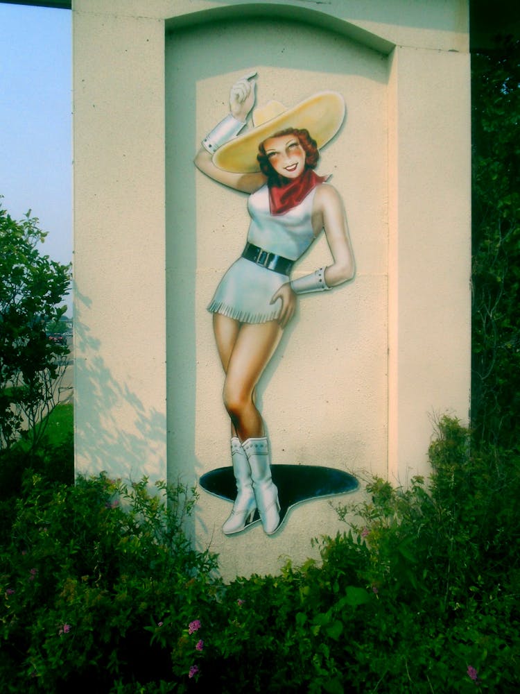 Cowgirl Painted On Concrete Wall