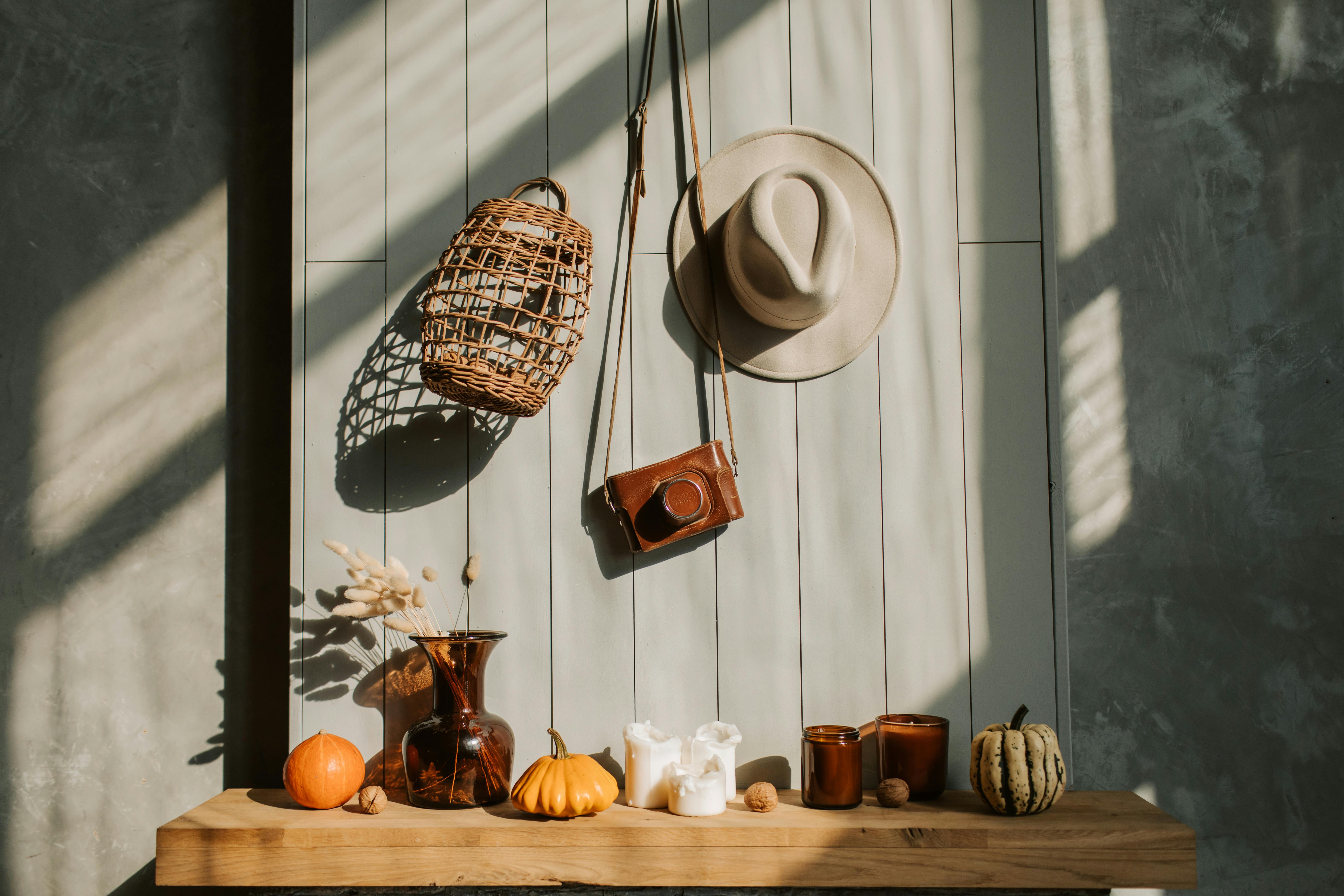 Free Sunlit composition with pumpkins, candles, and rustic decorations creates a cozy autumn ambiance. Stock Photo