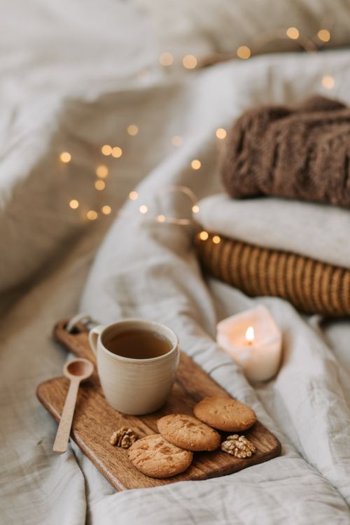 Free Warm and inviting scene featuring tea and cookies on a wooden board, perfect for a cozy morning. Stock Photo