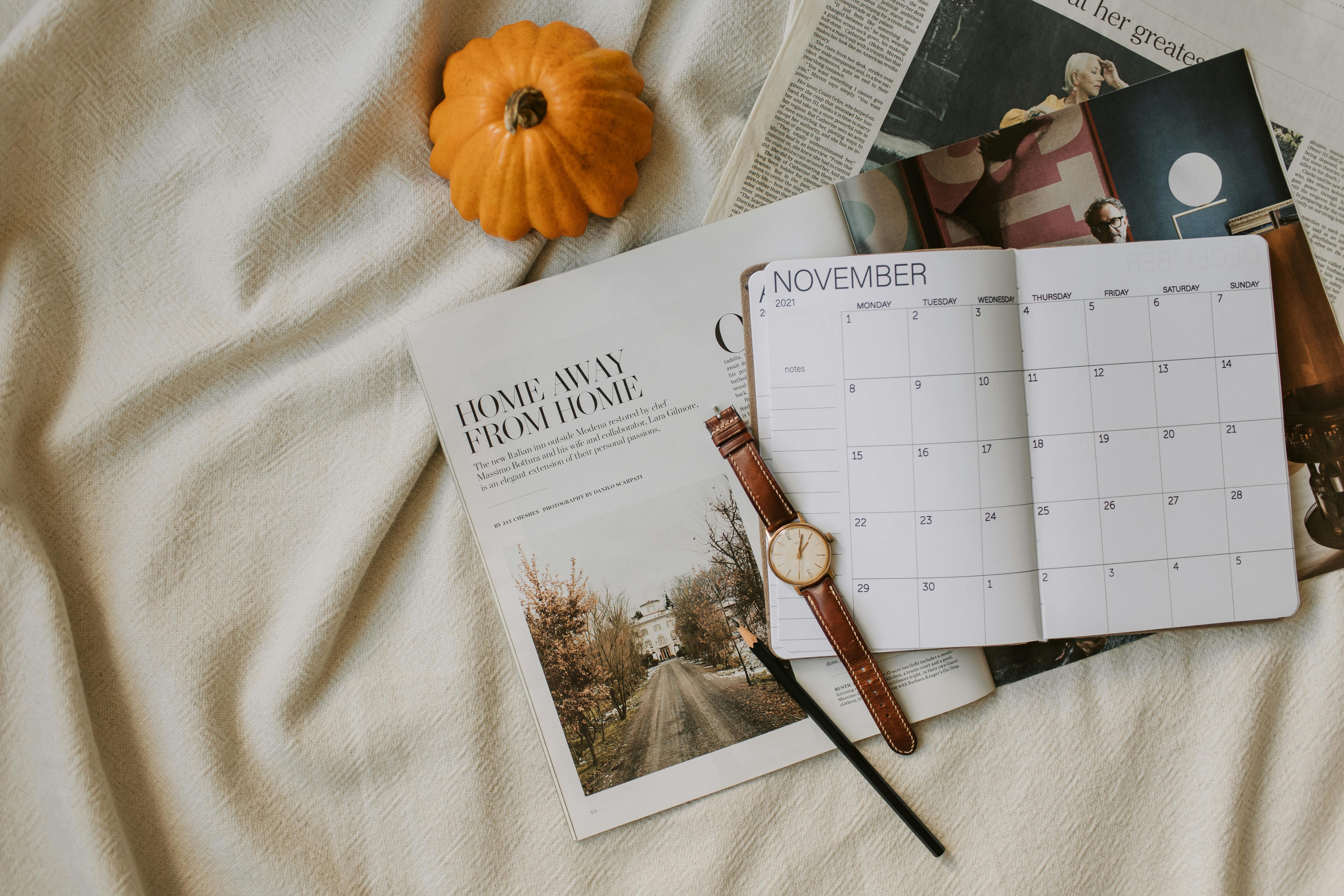 calendar magazines wristwatch and patty pan