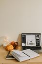 Notebook Beside a Laptop