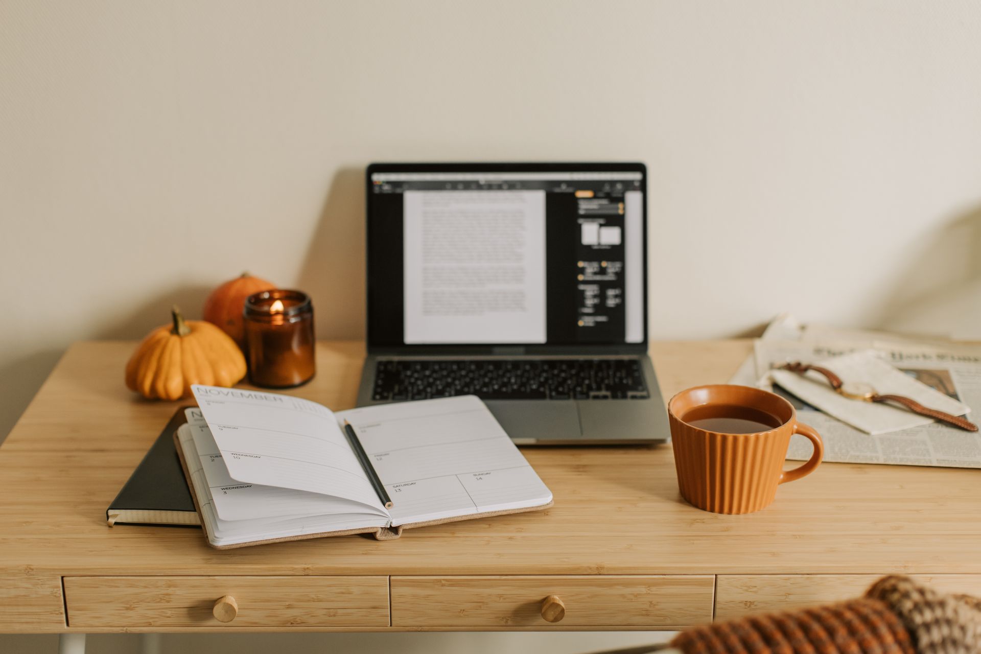Open Notebook Near the Laptop