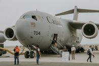 People Disembarking C-17 Transport Airplane