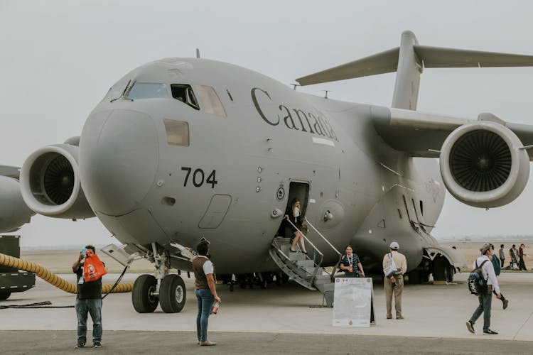 People Disembarking C-17 Transport Airplane