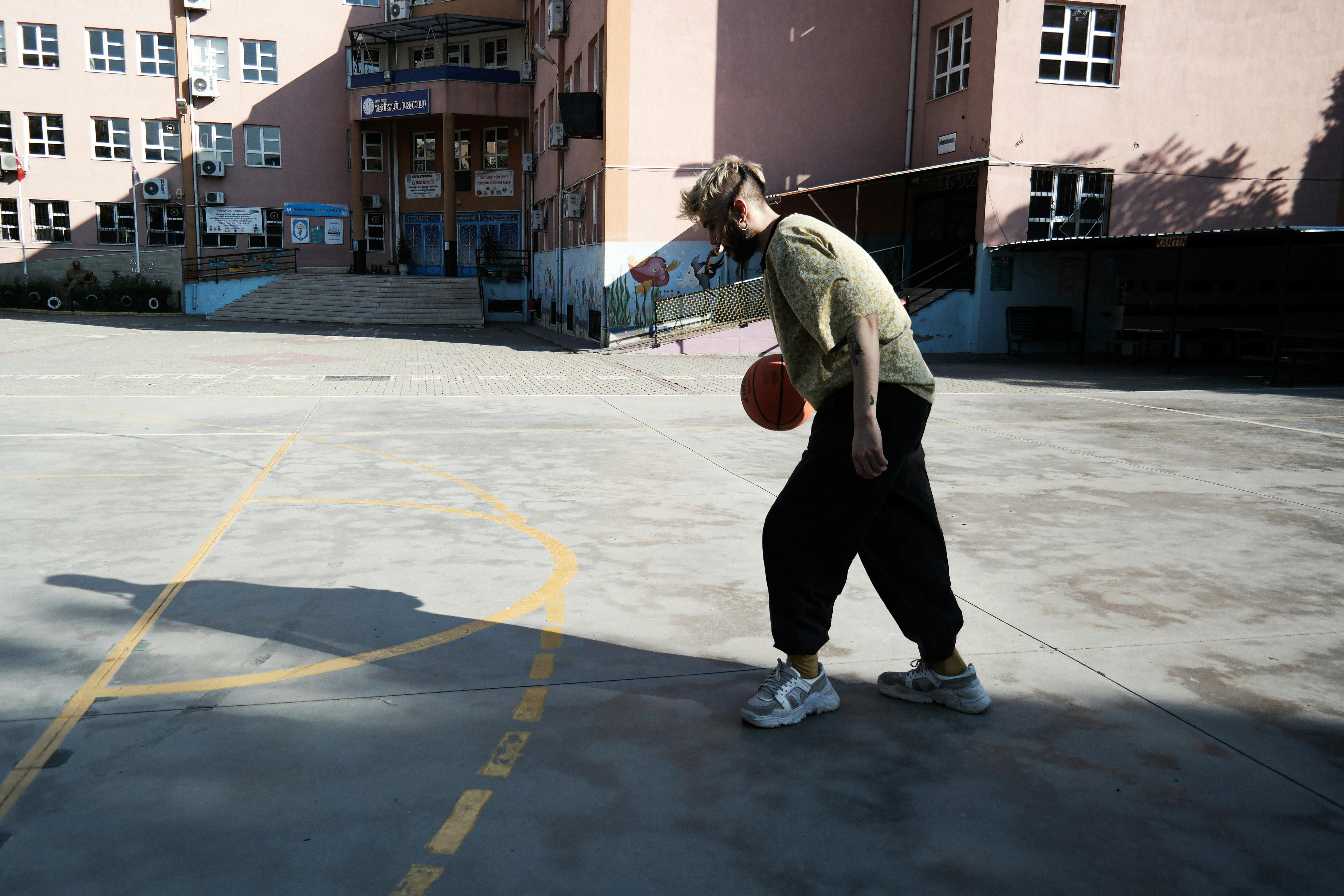 A Man Playing Basketball Alone · Free Stock Photo