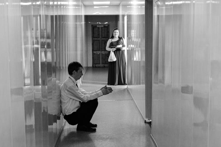 Two Adolescent People In Formal Outfit In School Corridor