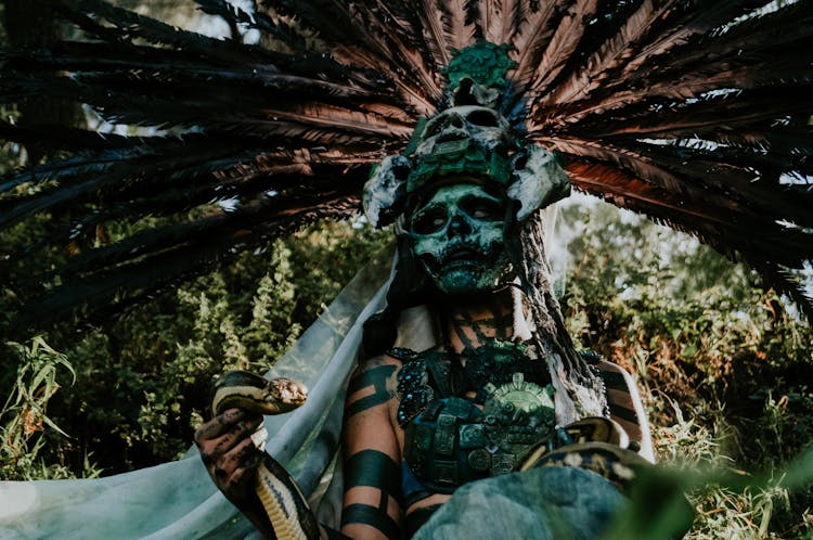 Person In Skull Mask Of Ancient God