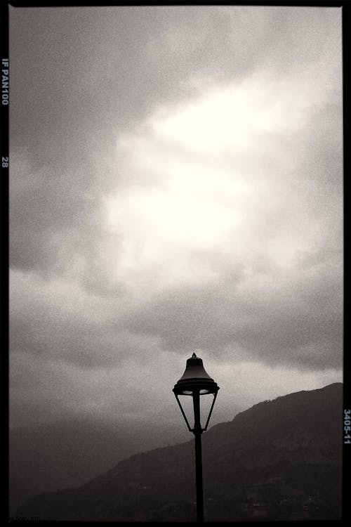 Grayscale Photo of a Street Light