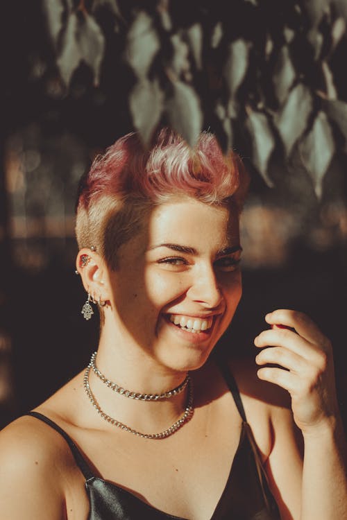 Smiling Woman with Pink Hair