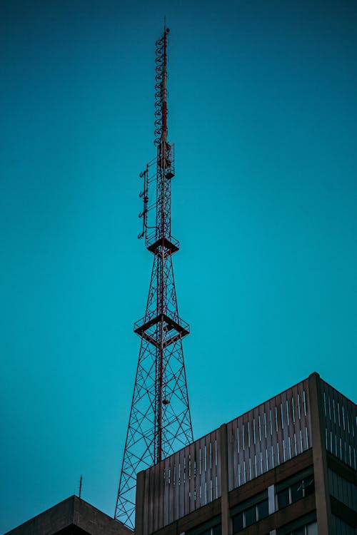 Photo of a Radio Tower Under a Blue Sky