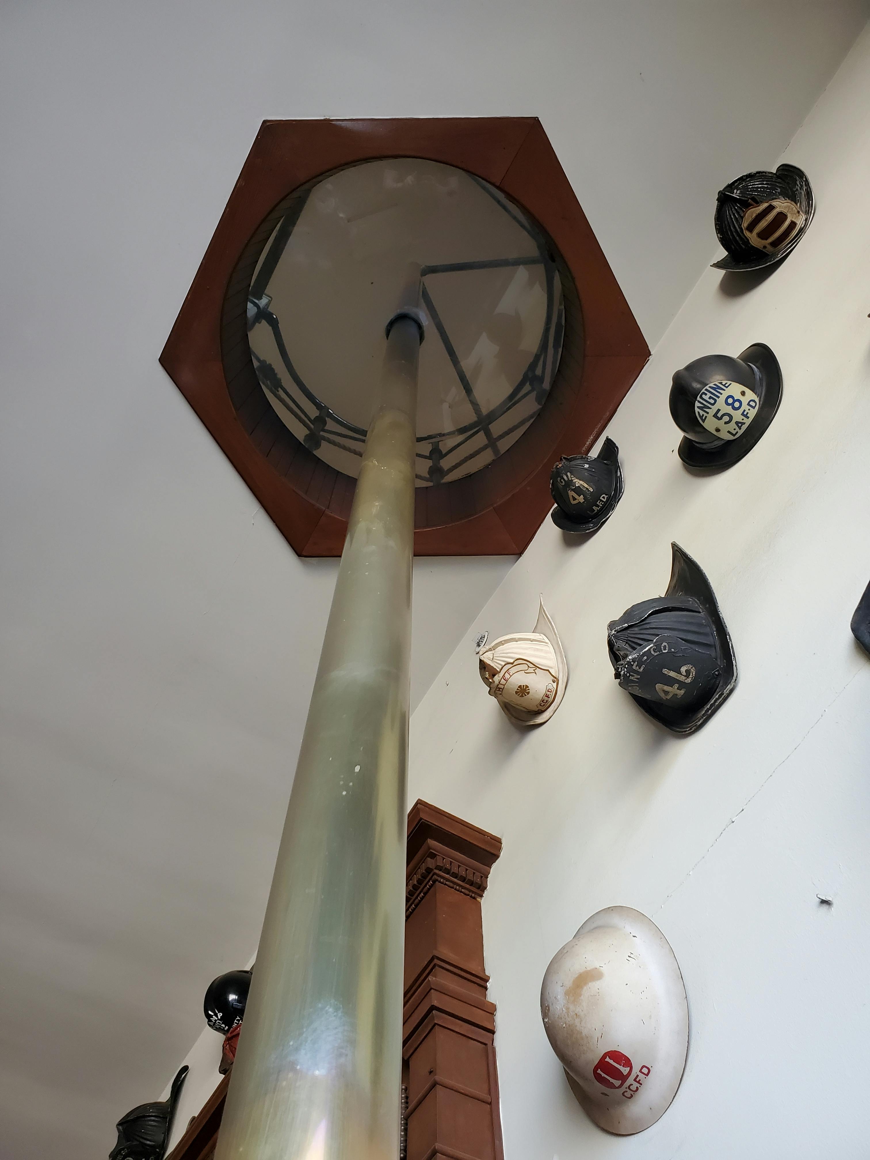 Soccer player walking with a child on a football pitch