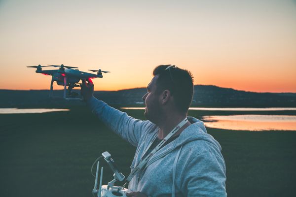 Scout Pro hovering low over a country road at dusk