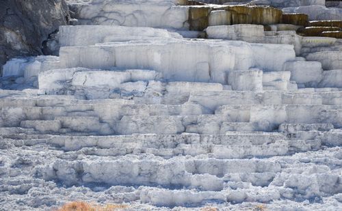 Free Explore the stunning limestone terraces of Mammoth Hot Springs in Yellowstone National Park. Stock Photo