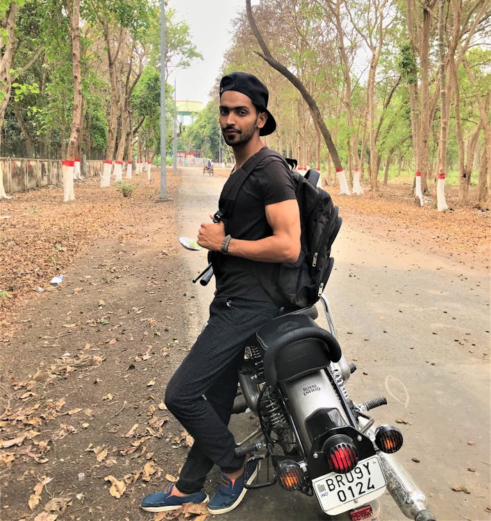 Man Sitting on Standard Motorcycle