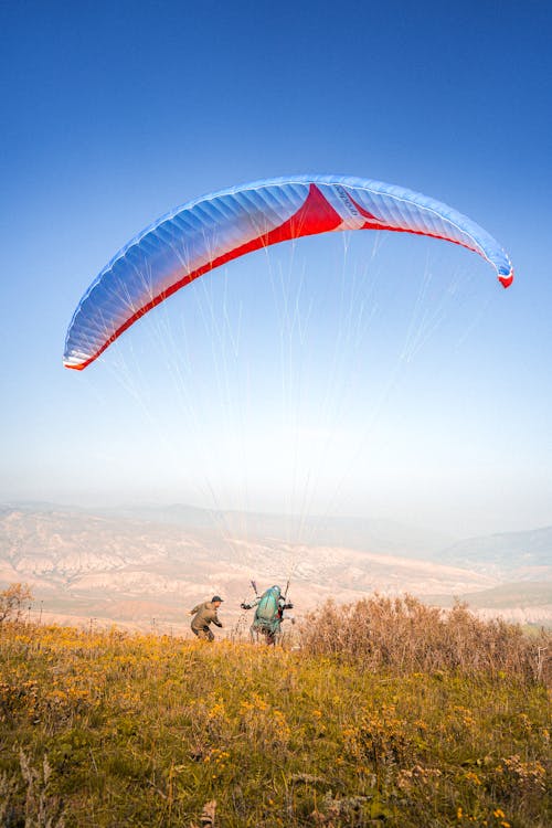 Gratis stockfoto met berggebied, gozers, parachute Stockfoto