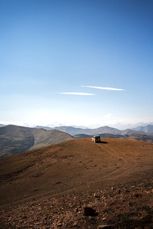 Off-road Car on Top of a Hill 