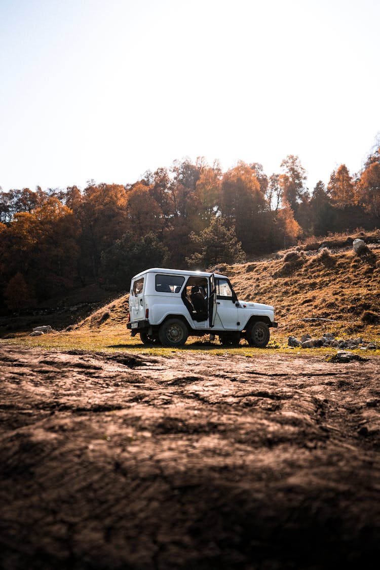 White Jeep On Muddy Ground