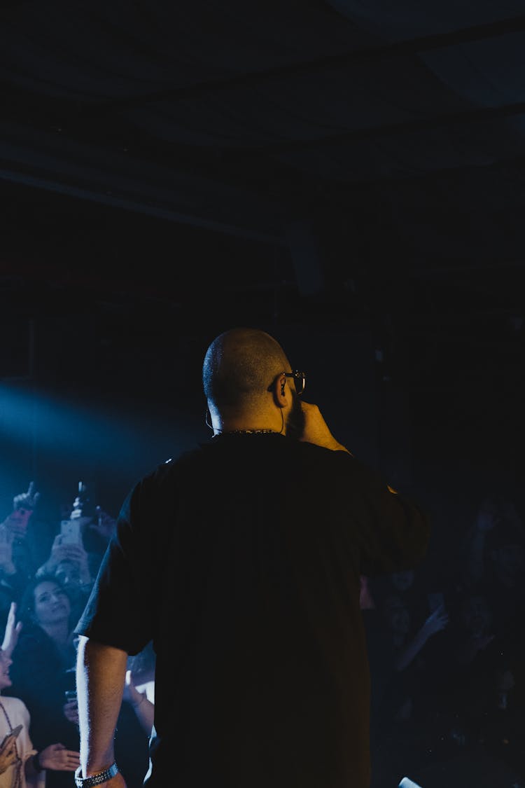 Man Singing In Front Of An Audience