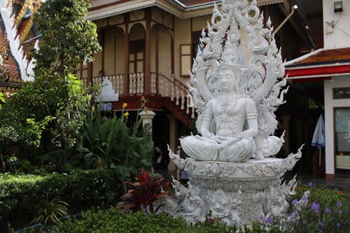 White Figure of Buddha in Yard