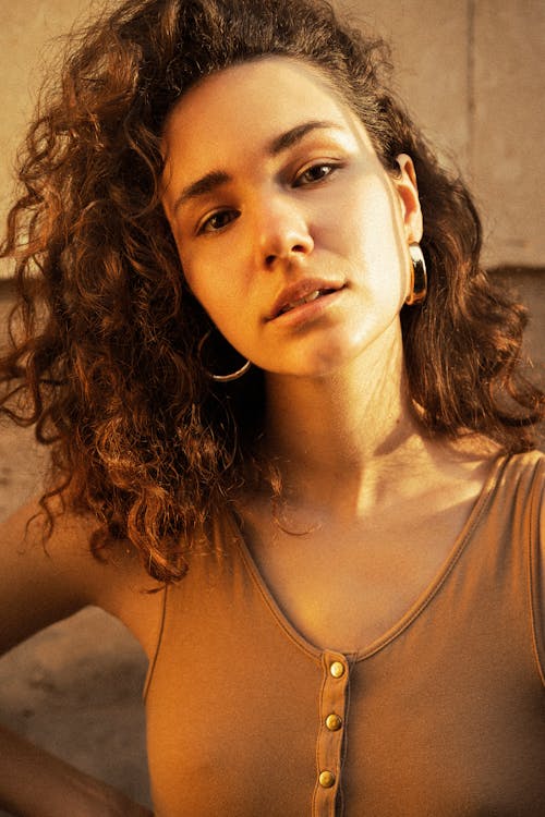 Girl with Curly Hair in Sunlight