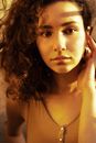 Woman Tucking Hair Behind Ear