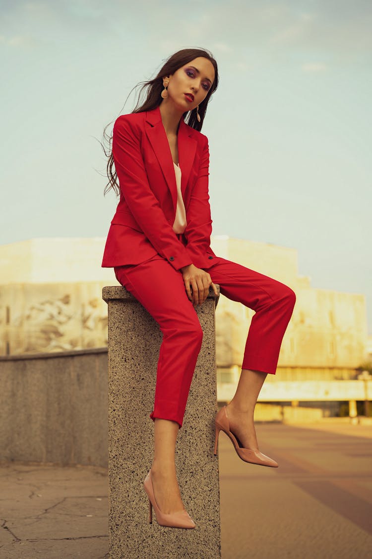 Woman In Red Suit Posing