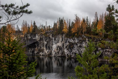 A Lake Near the Rock Formation with Trees