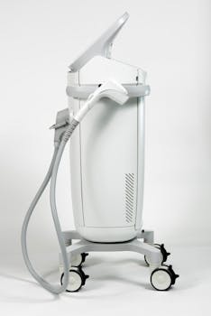 White modern ultrasound machine on a white background for wrinkle reduction.