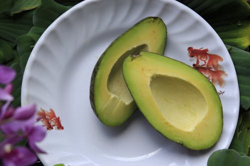 Free Sliced Avocado Fruits on Round White Ceramic Plate Stock Photo