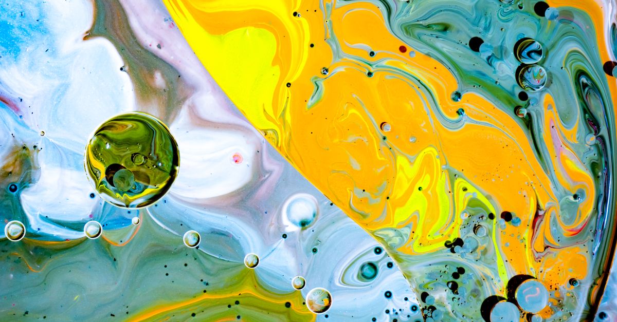 Colorful abstract image showcasing swirling patterns and vibrant colors in acrylic paint.