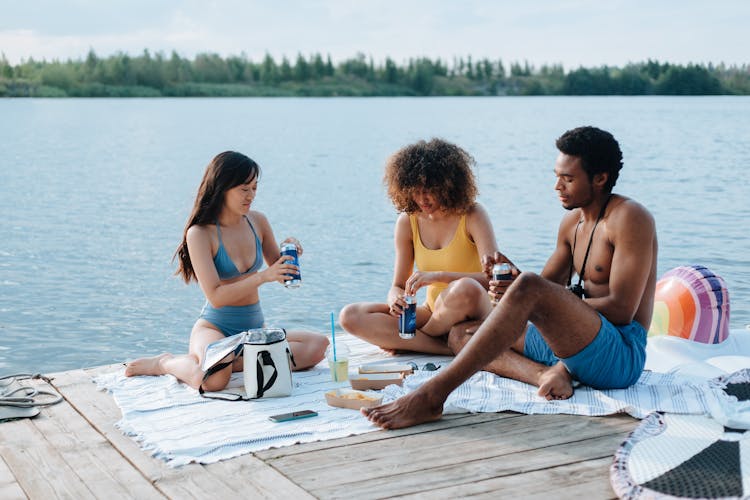 Portrait Of Friends Sitting At Picnic