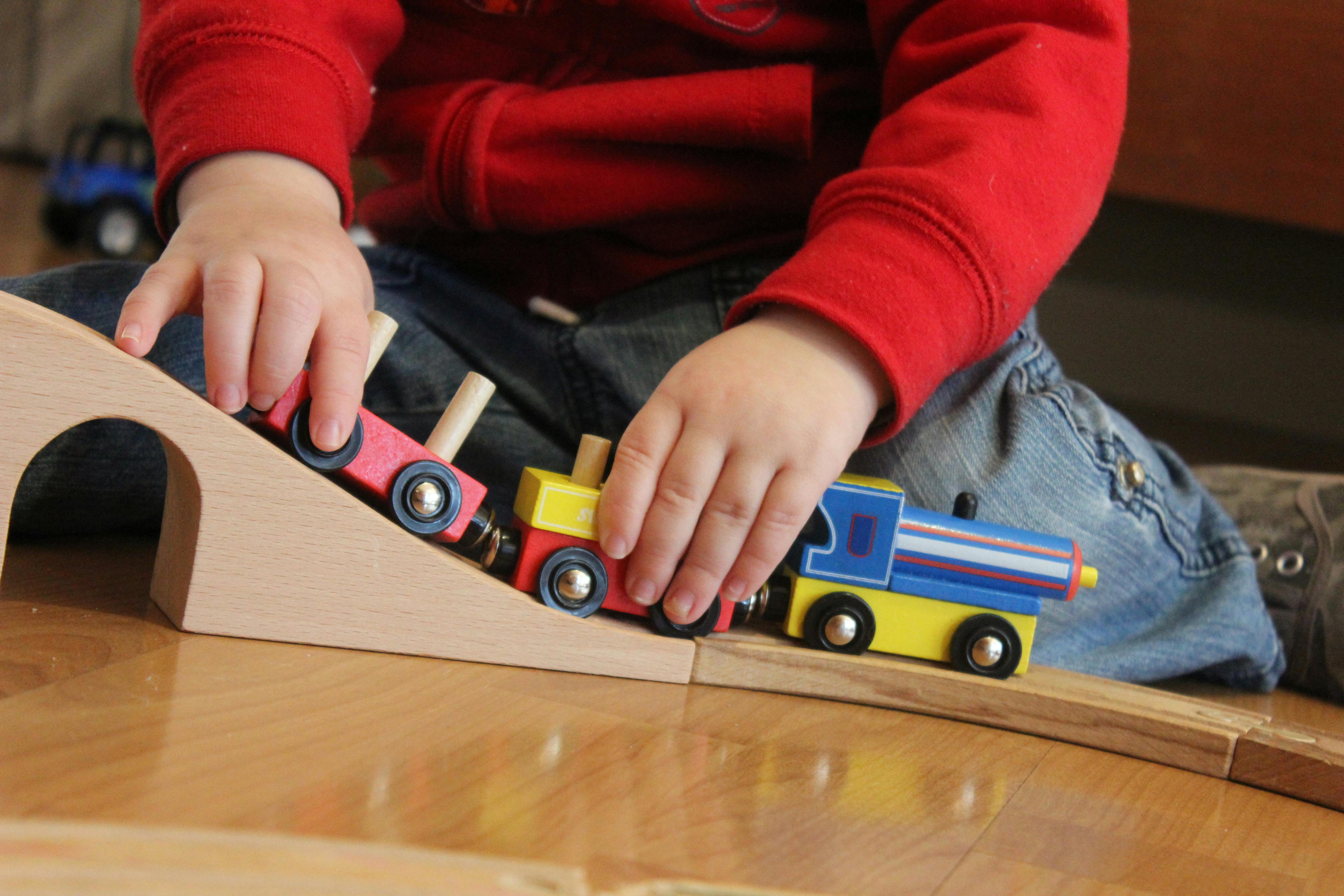 Free stock photo of boy, boy playing, toy train