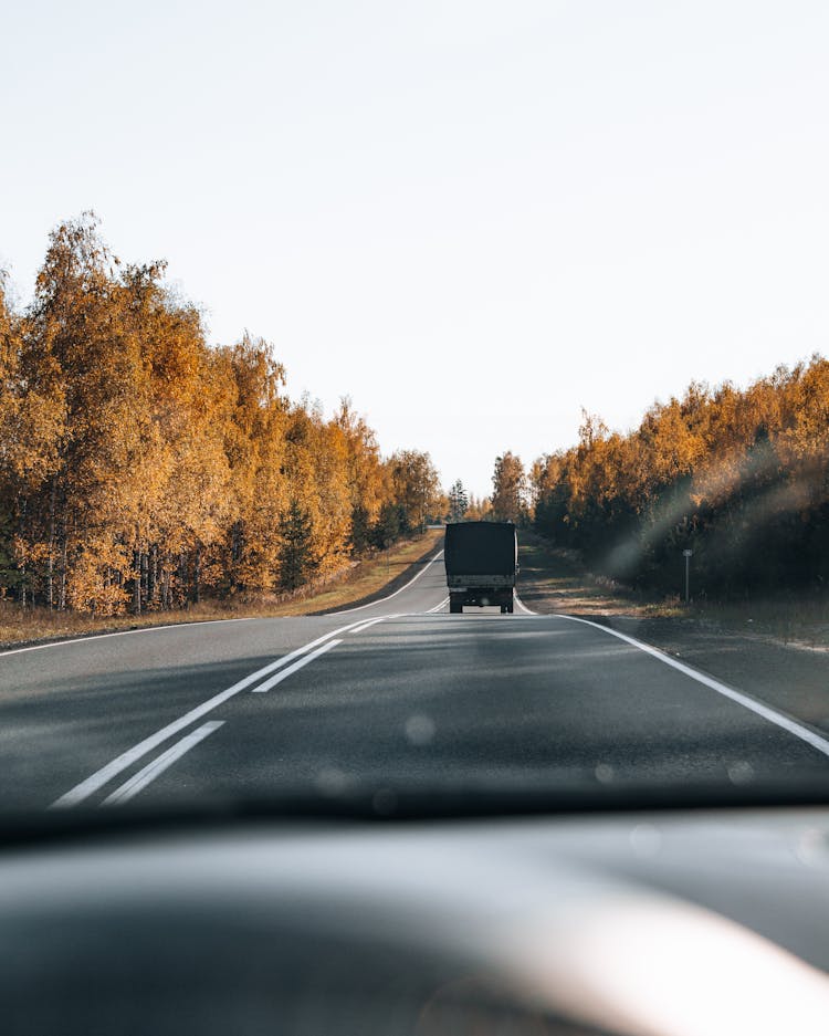 Vehicles Travelling The Road 